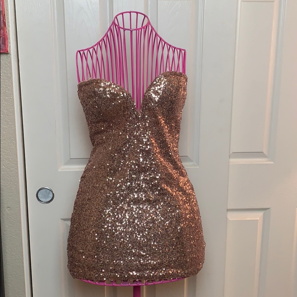 Deep cut sweetheart sequin dress.